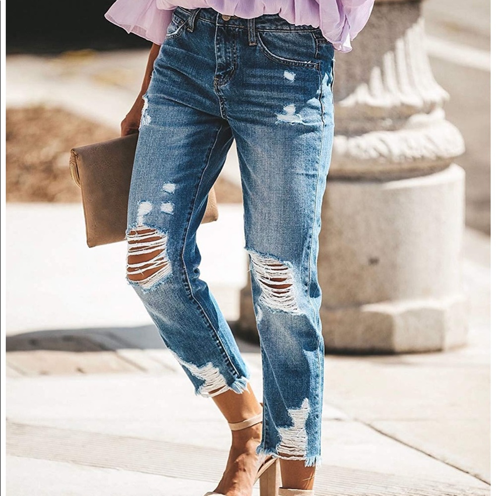Distressed women’s boyfriend denim jeans